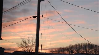 Sunrise over Trailers with Moon Zoom