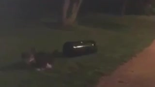Guy running and knocking down trash can falls