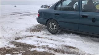 Car Modified With Wheels That Are Steel Gears