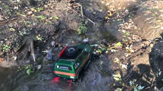 Green RC Car in Water and Mud