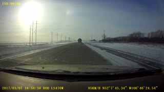 Round Bale Blows Off Truck