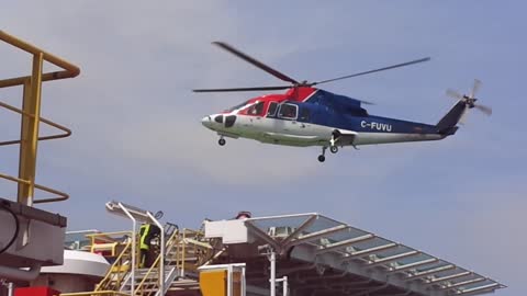 Helicopter landing on offshore oil rig