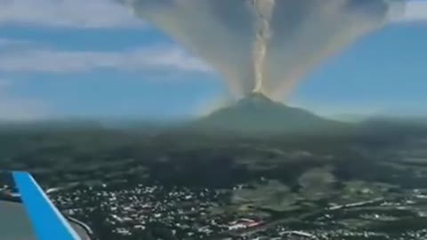 It is a scene of a volcanic eruption seen on an airplane. Should I say it's spectacular?