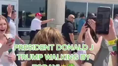 Trump Waves as People Cheer Him On