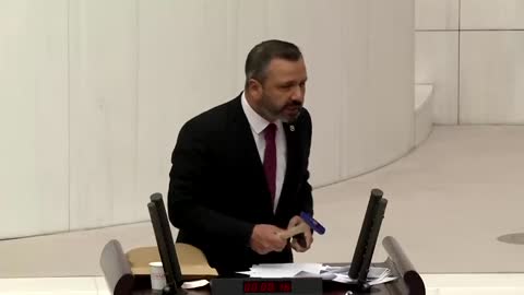 Turkish lawmaker smashes phone with hammer