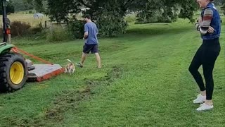 Grandson Lifts Grandpa Up in Tractor Bucket