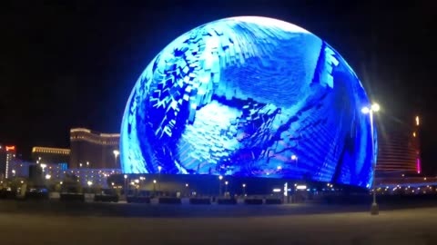 Las Vegas Sphere exterior show: Digital blue waves and shapes crash within a floating surf