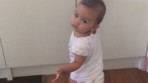 10 months old baby opens cupboard