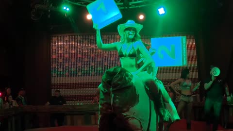 Bikini mechanical bull riding in Las Vegas: The winners share a ride before going home with cash