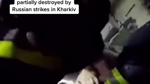 Ukrainian firefighters pull a man alive from rubble after Russian shelling