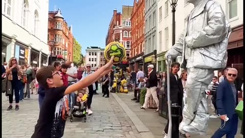 Boy's Hilarious Hijinks with Living Statue Man!