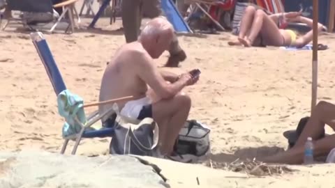 Shirtless Joe Biden enjoys a relaxing day at the beach in Rehoboth Beach, Delaware