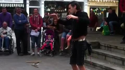 Street Performer Swallows a Sword
