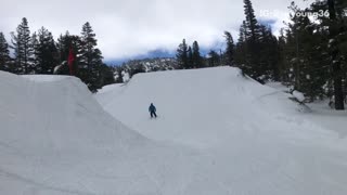 Skier does flip off side of ramp, hits head, and falls down