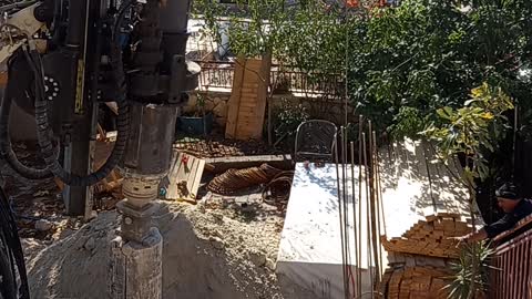 Inserting a foundation pile frame in the pit - GEAX EK40 is a multi-purpose piling rig 5