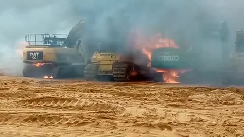 Burning Tractors on Construction Site