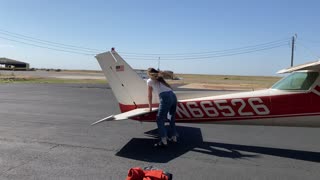 Strong woman moving plane