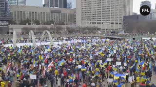 Thousands of Torontonians chant “Stand with Ukraine.”