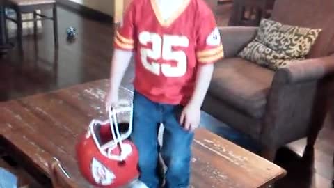 This helmet is just to big for this little football fan!