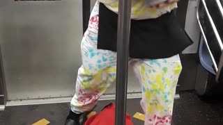 Man tye dye outfit magic tricks on train