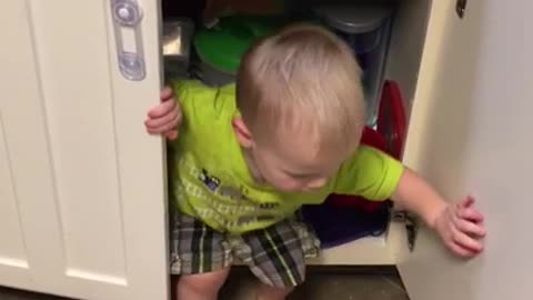 Baby's favorite spot is underneath the sink