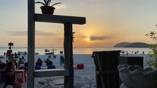 Various People Activities on The Beach At Sunset