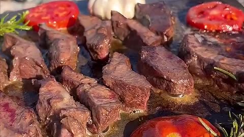 Very delicious grilled meat on the stone in nature