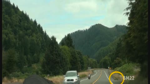 Motorcycle Almost Hits Coyote Running Across The Highway