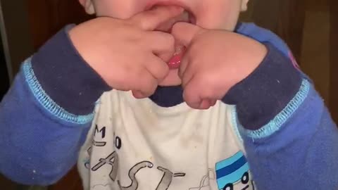 Baby tasting lemon