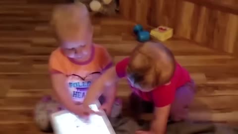 Cute twin babies fighting...