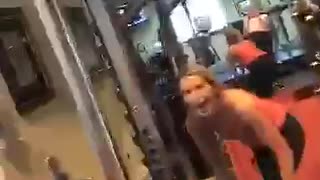 Girl trying to do squats drops weights