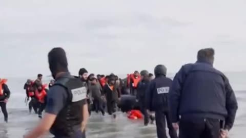 French police punctures a dinghy carrying doctors and engineers bound for UK