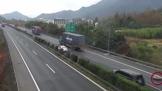 Motorist Has Near Miss WIth Falling Shipping Container