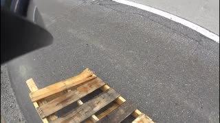 Motorcycle Narrowly Escapes Wooden Debris