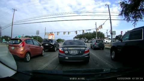 Woman driver cuts across 3 lanes and damn near hits someone