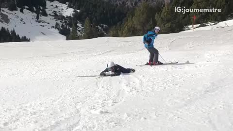 Skier tries to turn and stop downhill, both skis fall off his legs