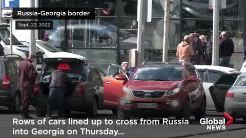 Russians queue for miles at border crossings after Putin's mobilization announcement