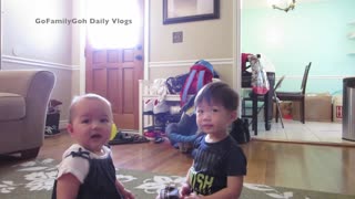Precious toddler stops crying baby with kiss