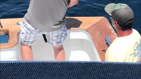 Fisherman Pulls His Friend's Fishing Pole To Make Him Believe He Has A Catch