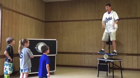 Kid's Errant Throw Almost Derails Balancing Juggler