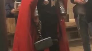 Man dressed as thor on subway station