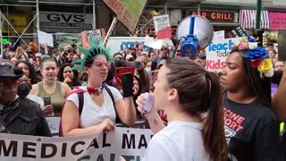 Rachel Maniscalo speaks at a protest against vaccine mandates