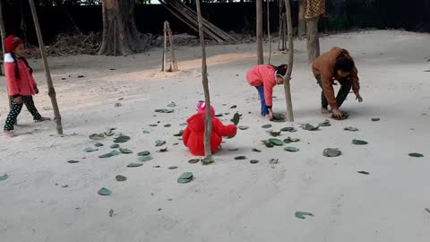 Children cleaning temple aria as play
