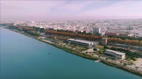 epic and beautiful aerial drone shot over urban and futuristic city of nearby future nature