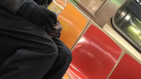 Man tries to hit on woman on subway train and she quickly gets out on her stop