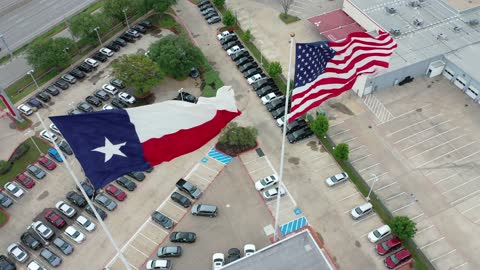 Old Glory Stands Proud with the Texas Flag