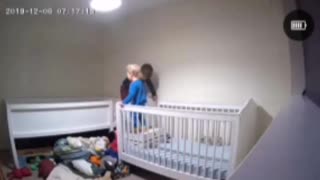 Boy Helps Brother out of Crib
