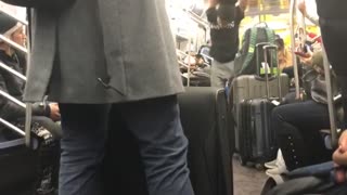 Subway performer spins upside down on handrails and dances