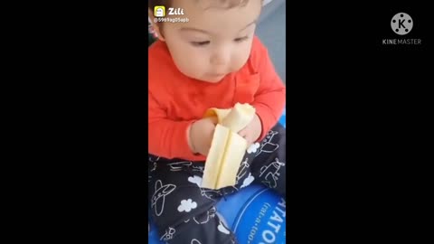 Cute baby eat banana