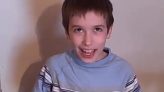 10 year old kid eating WarHeads